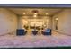 Inviting covered patio featuring comfortable seating and an outdoor fireplace perfect for outdoor entertaining at 1704 E Melrose St, Mesa, AZ 85203