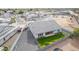 Spacious backyard boasts an expansive lush green lawn, privacy fence, and a paved driveway at 1704 E Melrose St, Mesa, AZ 85203