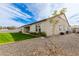 Spacious backyard with a pristine lawn, gravel landscaping, and mature trees offering privacy and tranquility at 1704 E Melrose St, Mesa, AZ 85203