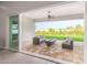 Outdoor patio with comfortable seating overlooking the manicured backyard and landscape at 1704 E Melrose St, Mesa, AZ 85203