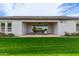 Expansive backyard with well-maintained lawn and covered patio provides space for relaxation and entertainment at 1704 E Melrose St, Mesa, AZ 85203