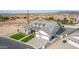 Stunning home showcasing a three car garage, dormer windows, and well manicured landscaping at 1704 E Melrose St, Mesa, AZ 85203
