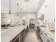 Spacious kitchen features a long island with white countertops and stainless steel appliances at 1704 E Melrose St, Mesa, AZ 85203