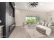 Bright living room with large sectional sofa, fireplace, and view of the backyard at 1704 E Melrose St, Mesa, AZ 85203