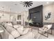 Cozy living room features a fireplace and comfortable seating area with a view of the backyard at 1704 E Melrose St, Mesa, AZ 85203