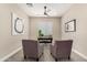 Comfortable home office featuring neutral colors, a ceiling fan, and natural light at 1704 E Melrose St, Mesa, AZ 85203