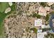 Aerial view shows the home, landscaping, a golf course and desert terrain surrounding the property at 1725 E Staghorn Ln, Carefree, AZ 85377