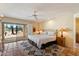 Bedroom with natural light, a ceiling fan, and outdoor access at 1725 E Staghorn Ln, Carefree, AZ 85377