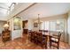 Bright dining area with large windows, a chandelier, and tile flooring at 1725 E Staghorn Ln, Carefree, AZ 85377