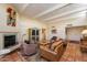 Inviting living room with fireplace, comfortable furniture, and tile floors at 1725 E Staghorn Ln, Carefree, AZ 85377