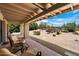 Relaxing outdoor patio featuring comfortable seating and views of desert landscaping under a sunny sky at 1725 E Staghorn Ln, Carefree, AZ 85377