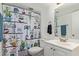 Fresh bathroom featuring patterned shower curtain, white vanity, and essential fixtures at 1730 W Emelita Ave # 1008, Mesa, AZ 85202