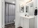 Bright bathroom featuring a vanity with dual mirrors and a shower/tub combo, offering comfort and style at 1730 W Emelita Ave # 1008, Mesa, AZ 85202