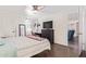 Comfortable bedroom with a ceiling fan and TV, creating a cozy retreat for relaxation at 1730 W Emelita Ave # 1008, Mesa, AZ 85202