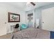 Well-lit bedroom with fan, cozy decor, and practical desk space for work or study at 1730 W Emelita Ave # 1008, Mesa, AZ 85202