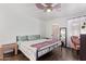 Cozy bedroom featuring hardwood floors, ceiling fan, and natural light through the windows at 1730 W Emelita Ave # 1008, Mesa, AZ 85202