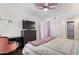 Spacious bedroom with a TV, dresser, and chair for relaxation and entertainment at 1730 W Emelita Ave # 1008, Mesa, AZ 85202