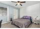 This cozy bedroom has a ceiling fan, closet and stylish accents at 1730 W Emelita Ave # 1008, Mesa, AZ 85202