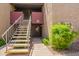 Exterior view of the property with stairs leading to upper units and well maintained landscaping at 1730 W Emelita Ave # 1008, Mesa, AZ 85202