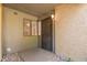 Inviting entryway with a decorative security door and neutral colored rock landscape at 1730 W Emelita Ave # 1008, Mesa, AZ 85202