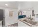 Bright kitchen with granite counters and stainless steel appliances open to the living area at 1730 W Emelita Ave # 1008, Mesa, AZ 85202