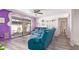 Comfortable living room with a large sliding door, vinyl flooring, and modern wall decor at 1730 W Emelita Ave # 1008, Mesa, AZ 85202