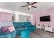 Cozy living room featuring vinyl floors, ceiling fan, and comfortable furnishings at 1730 W Emelita Ave # 1008, Mesa, AZ 85202