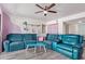 Cozy living room featuring vinyl floors, ceiling fan, and comfortable furnishings at 1730 W Emelita Ave # 1008, Mesa, AZ 85202