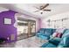 Comfortable living room with a large sliding door, vinyl flooring, and modern wall decor at 1730 W Emelita Ave # 1008, Mesa, AZ 85202