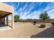 Spacious, low maintenance backyard with mature landscaping and stone perfect for relaxing or entertaining at 18076 W Redwood Ln, Goodyear, AZ 85338