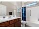 Well-maintained bathroom with a vanity, sink, and shower with updated fixtures and a clean design at 18076 W Redwood Ln, Goodyear, AZ 85338