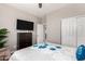 Inviting bedroom designed for comfort and style, offering lots of space and a ceiling fan at 18076 W Redwood Ln, Goodyear, AZ 85338