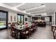 Large community room featuring a spacious dining area, kitchen, and stylish contemporary décor at 18076 W Redwood Ln, Goodyear, AZ 85338
