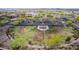 Bird's-eye view of the fenced dog park surrounded by trees, perfect for pet owners to enjoy outdoor time at 18076 W Redwood Ln, Goodyear, AZ 85338