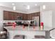 Kitchen featuring stainless appliances, granite counters, breakfast bar, and ample cabinet space at 18076 W Redwood Ln, Goodyear, AZ 85338