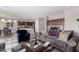 Spacious living room with an open layout, including a kitchen view and a comfortable seating area at 18076 W Redwood Ln, Goodyear, AZ 85338