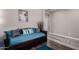 Comfortable living room area with a futon and stylish decor at 18076 W Redwood Ln, Goodyear, AZ 85338