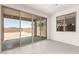 Bright room with sliding glass doors leading to the backyard at 18189 W Hess St, Goodyear, AZ 85338