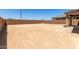 Large, flat backyard with block wall, ready for a custom landscape design at 18189 W Hess St, Goodyear, AZ 85338