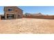 The expansive backyard features a covered patio and block wall at 18189 W Hess St, Goodyear, AZ 85338