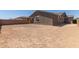 Unlandscaped backyard featuring home exterior and block wall at 18189 W Hess St, Goodyear, AZ 85338