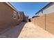 Unlandscaped backyard featuring block walls and the exterior of neighboring homes at 18189 W Hess St, Goodyear, AZ 85338