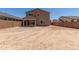 The expansive backyard features a covered patio and privacy wall at 18189 W Hess St, Goodyear, AZ 85338