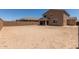 Expansive backyard featuring block wall, covered patio, and desert landscaping potential at 18189 W Hess St, Goodyear, AZ 85338