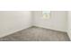 Cozy bedroom with soft carpet and a window letting in natural light at 18189 W Hess St, Goodyear, AZ 85338