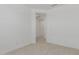 Bright bedroom featuring light tile flooring and a doorway into another room at 18189 W Hess St, Goodyear, AZ 85338