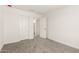 Bedroom featuring carpet flooring and closet doors at 18189 W Hess St, Goodyear, AZ 85338