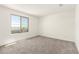 Bright bedroom with a large window offering an outdoor view at 18189 W Hess St, Goodyear, AZ 85338