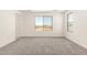 Spacious bedroom with neutral carpet and windows that provide lots of natural light at 18189 W Hess St, Goodyear, AZ 85338