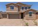 Inviting two-story home with a three-car garage and paved driveway at 18189 W Hess St, Goodyear, AZ 85338